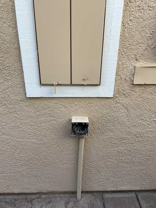 conduit terminating into ground below concrete