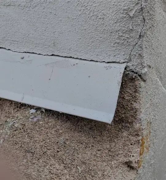 Stucco weep screed transition at corner over roof