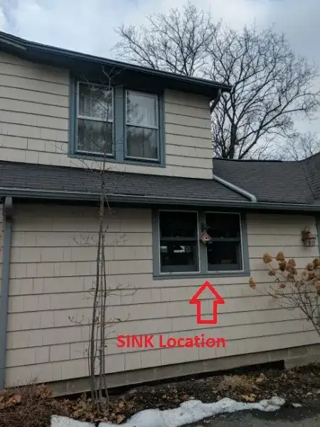 Exterior - I have included this picture to illustrate how difficult it would be to have exterior vent. The top of the 2nd roof is rubber/flat. The vent stack for bathrooms is far removed.