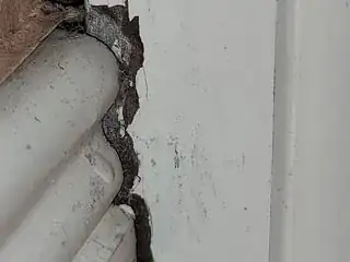 Fibers near baseboard moulding