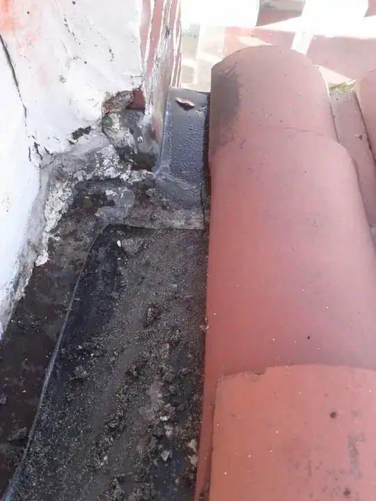 rusty 1938 tile roof stucco wall flashing