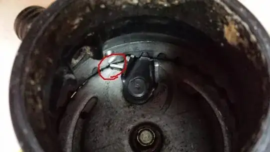 Metal piece wedged in garbage disposal