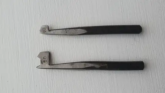 mystery bits 1- a '60' and a '10' side by side