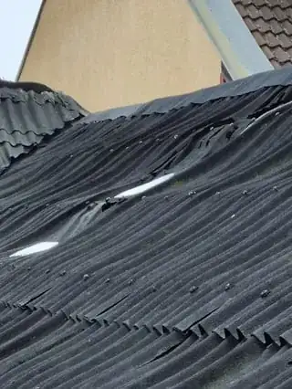 Warped asbestos roof