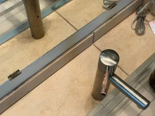 Faucet sitting flush on tile