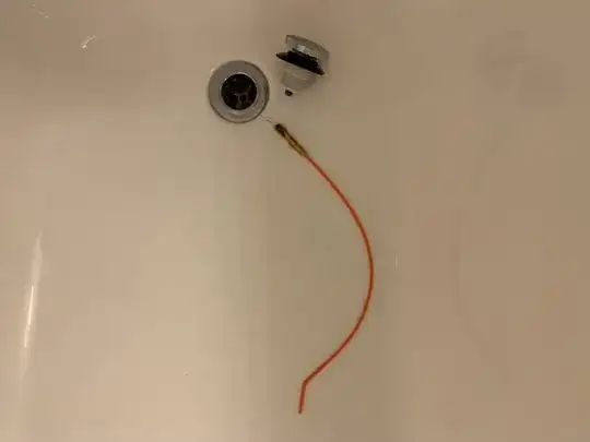 An image of the area of a bathtub surrounding the drain. A pop-up drain stopper is lying next to the drain, along with a long, flexible, orange plastic rod. One end of the rod is bent at a relatively sharp angle, and the other is wrapped in a yellow, hook-covered material. A number of hairs are entangled in the hooks.