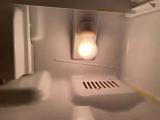 Vent at the bottom of the fridge behind the veggie drawer