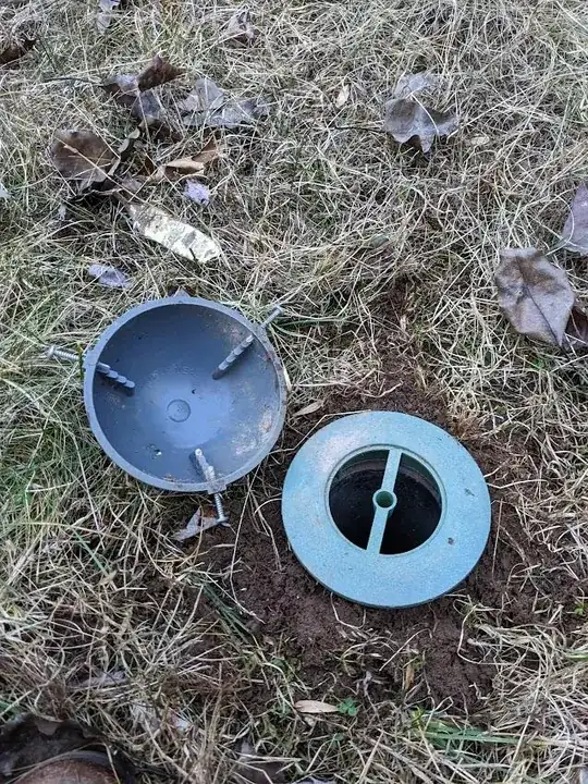 Sewer vent in yard with lid off