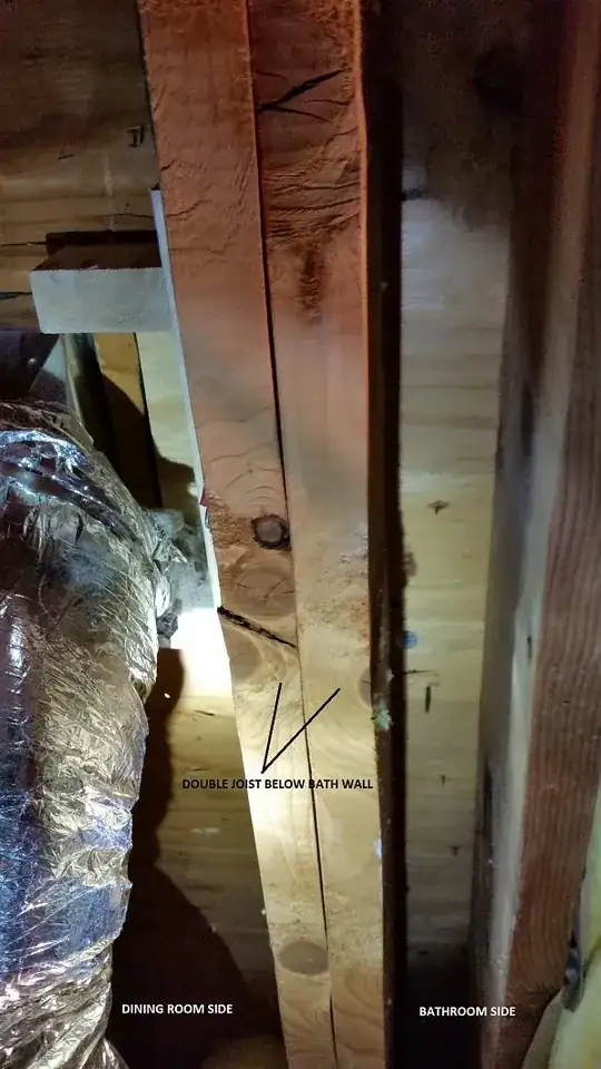 Double joist below bath wall