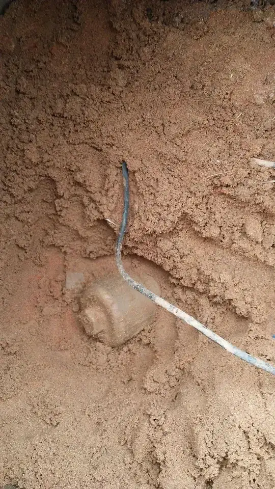 Round box with nut near water meter