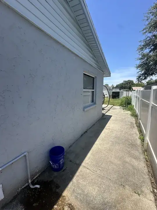 pipe with wall to rear of house