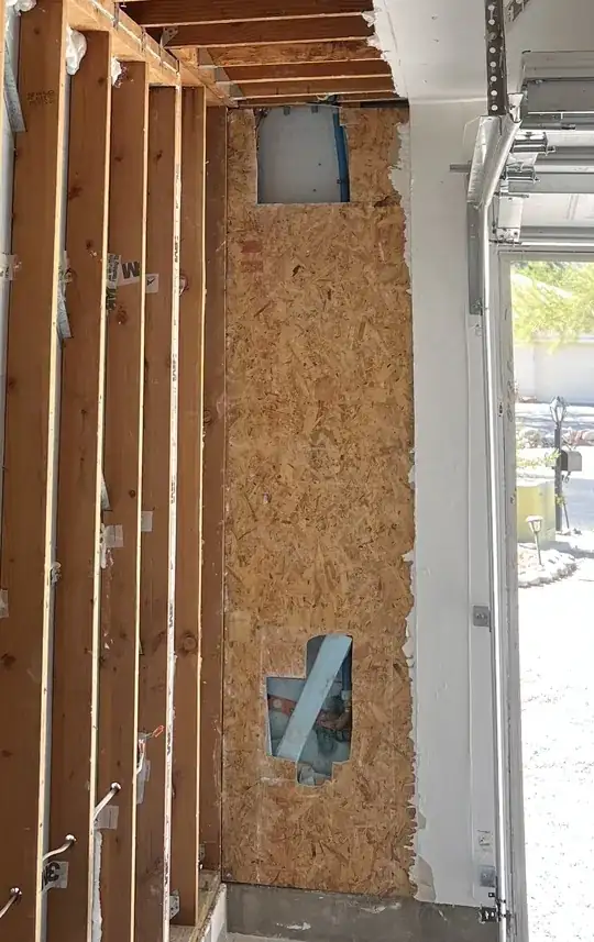 garage wall OSB with holes