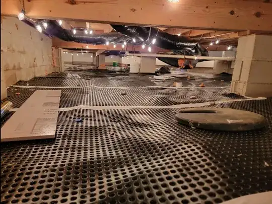 crawl space lit with old Christmas lights.