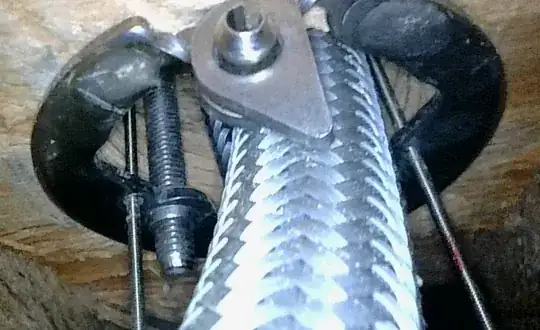 close up of the ring with a bolt with inset hex head holding two pieces together