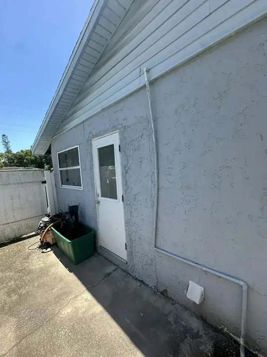 side of house with drain pipe