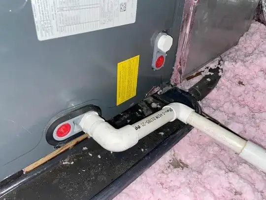 Picture of overflow pipe connected to the HVAC