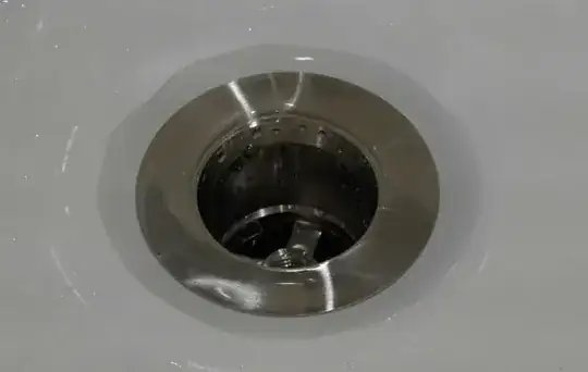 water around tub drain flange