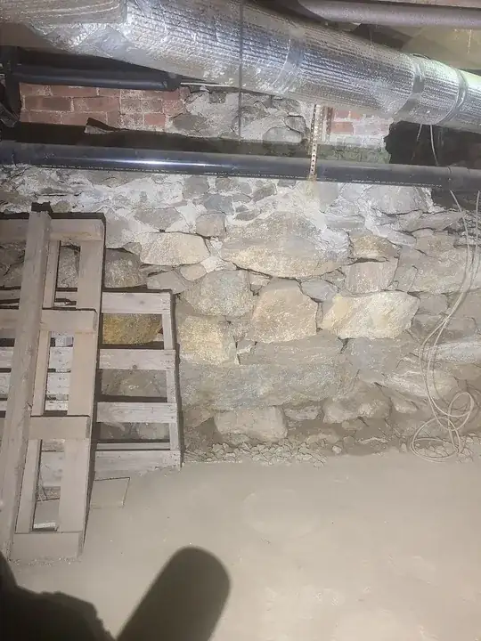 mortar in the top, but this very much looks like a repair. foundation on the right was blown out to connect to an addition