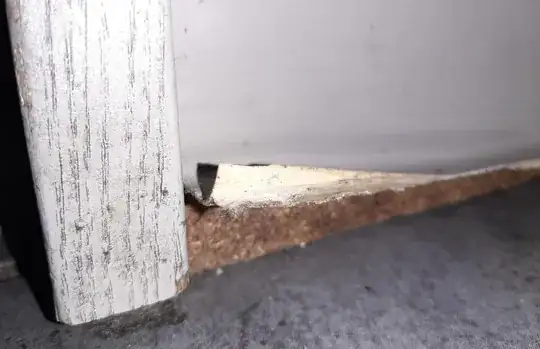 detail of curled up veneer and particle board