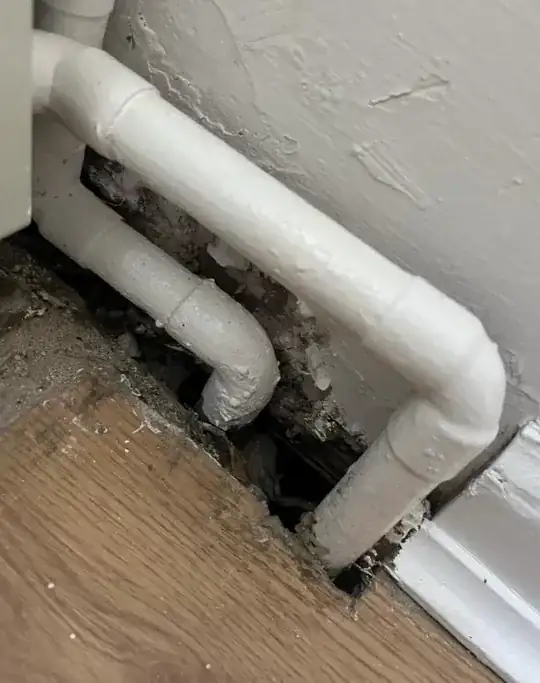Hole around heater pipes through the floor