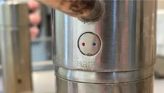 close up of hot/cold indicator under handle