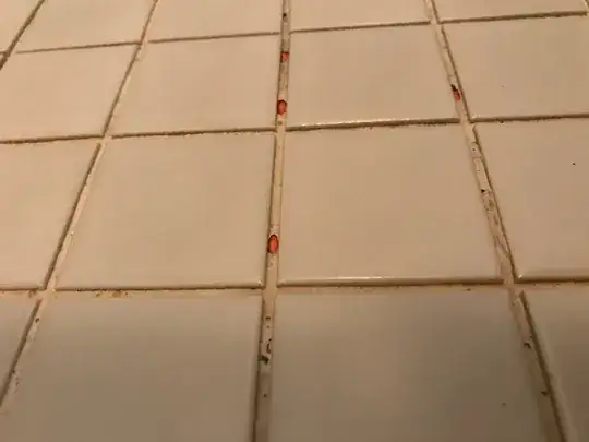 Grout lines containing unidentified orange material