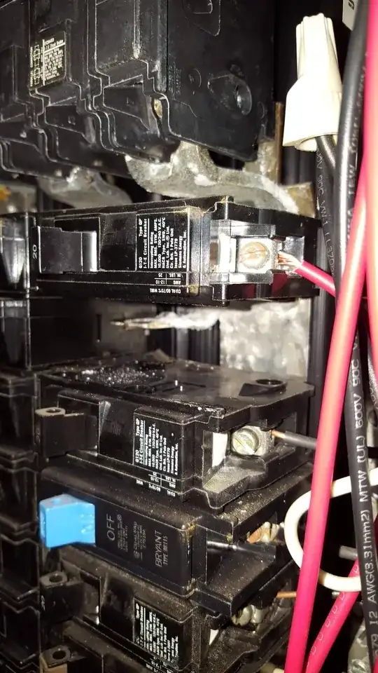 White deposits under breaker on hot bus bar in electrical panel