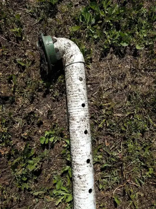 close up of pipe showing holes