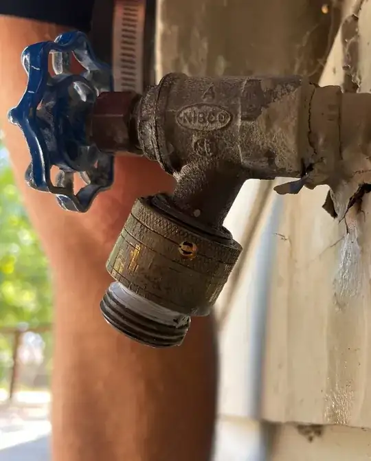 Image of a backflow preventer with a hole drilled out where the set screw used to be