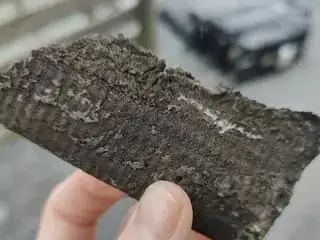 Pieces of old asbestos cement roof falling off