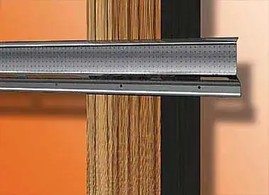 A piece of resilient channel on a stud