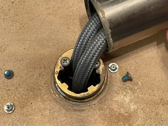 base with exposed screw heads