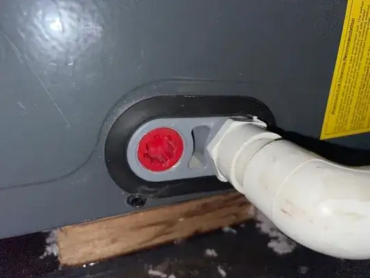 Close up of the fastener where the overflow connects to the HVAC system