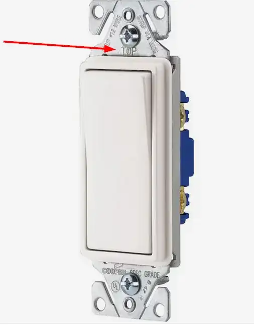 Image of the switch with an arrow pointing to the word "TOP" embossed on the yoke