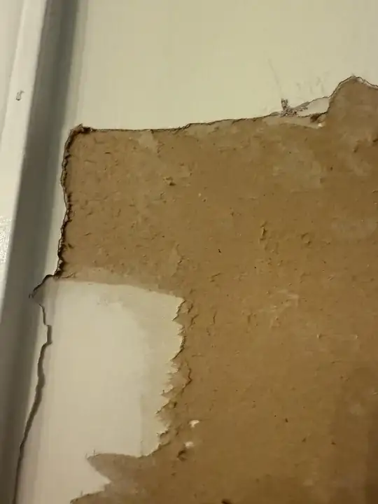 Damaged drywall paper up close