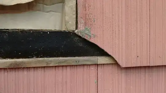The cracked shingle, showing the cant strip overlaying the shingle below it