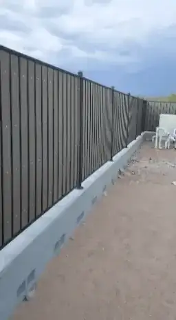 fence flexing in wind