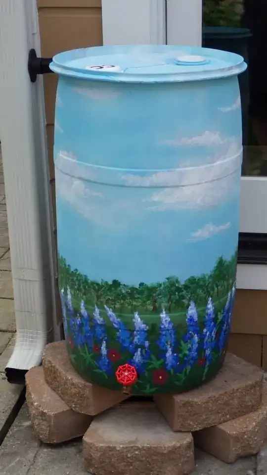 rain barrel painted with bluebonnets