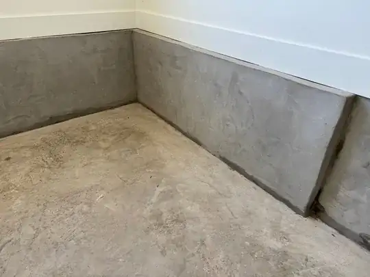 Image of garage wall showing discoloration at bottom