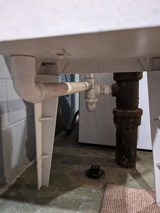 Plumbing below the utility sink