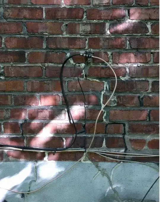 coax cable join on exterior brick wall
