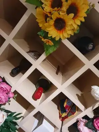 Wine rack with lifted paint from the oil spill