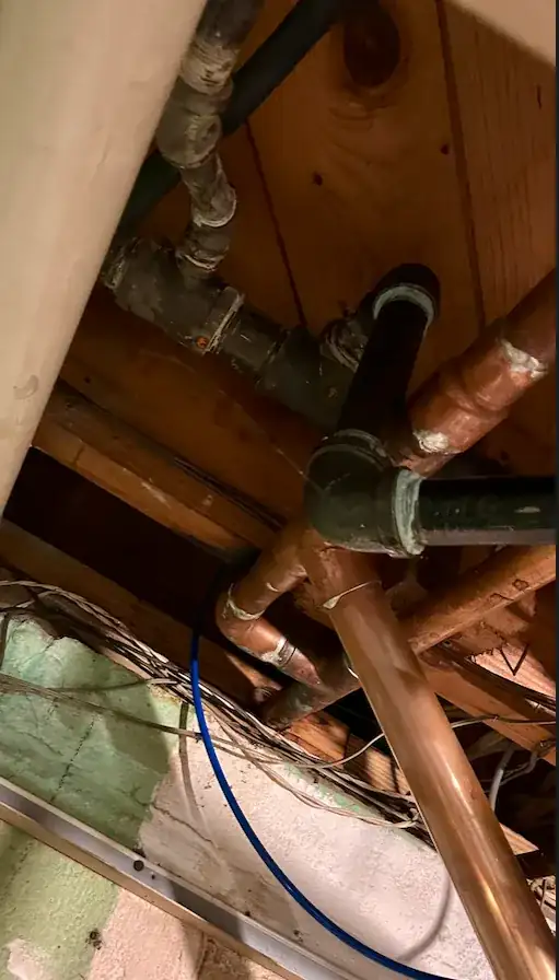Ceiling view with black return pipes connecting