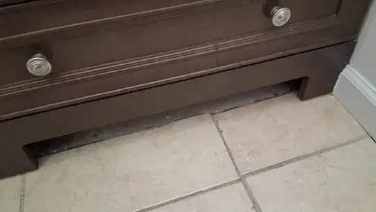 Vanity base showing tile edge through cutout