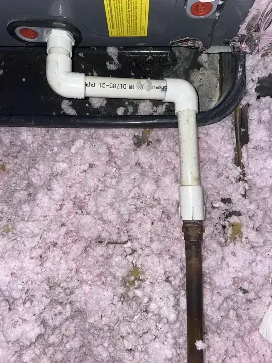 Picture of plastic overflow pipe connected to copper pipe