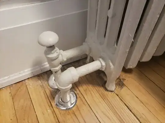 The bottom of a radiator with a knob