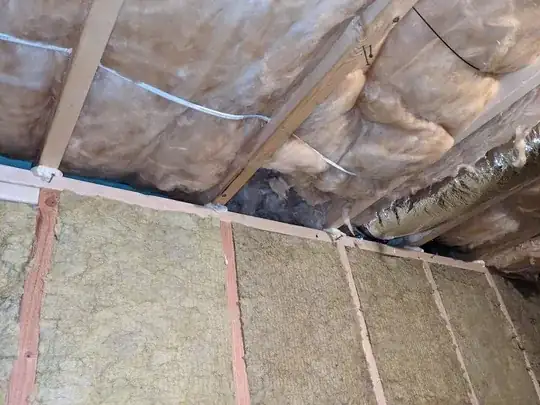 a picture of where the insulation in the ceiling would get in the way of me creating a continuous barrier across the wall to the ceiling