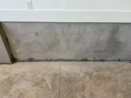 Image of garage wall showing discoloration at bottom