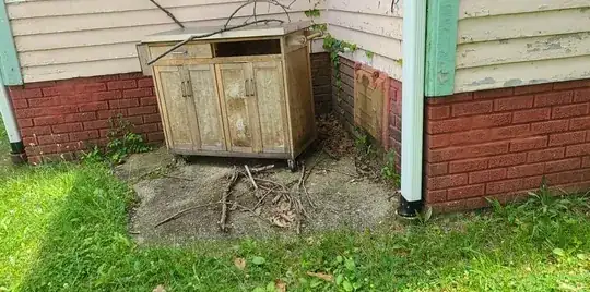 In terms of basement moisture, this is the second worst spot where it develops. But I don't know what to do about this random concrete block right against the wall of the house. Does it need to be removed or can I kind of get a seal onto where it touches the house or something?