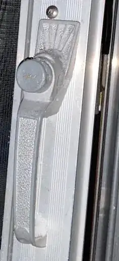 Photo of screen door handle with push button